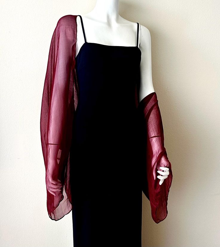 A beautiful red dress with a shawl topper. This is an excellent wedding officiant outfit.