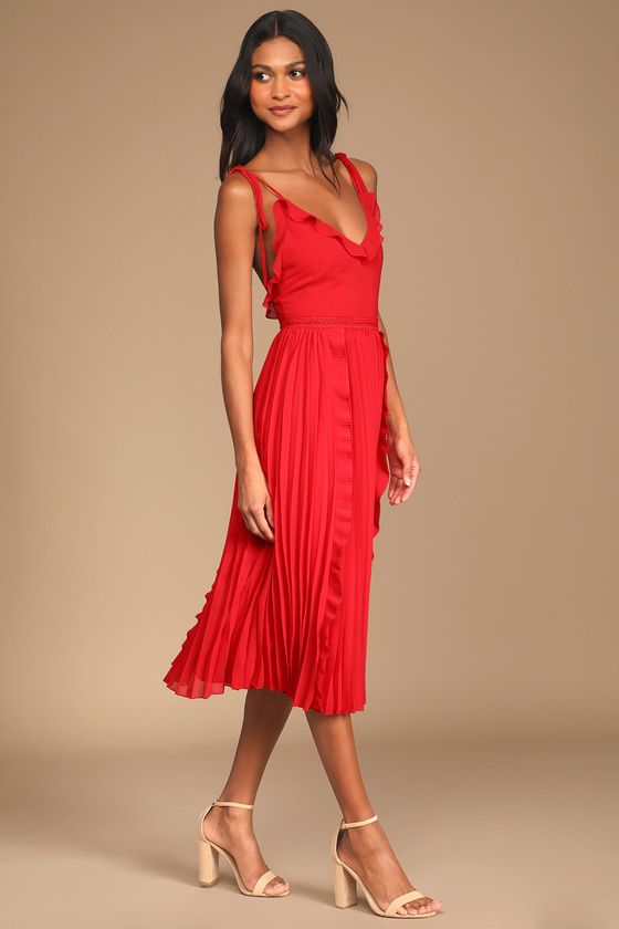 This is a red, strappy dress. It is being used as an example of e beautiful wedding guest dress, but it not an example of a good wedding officiant outfit.