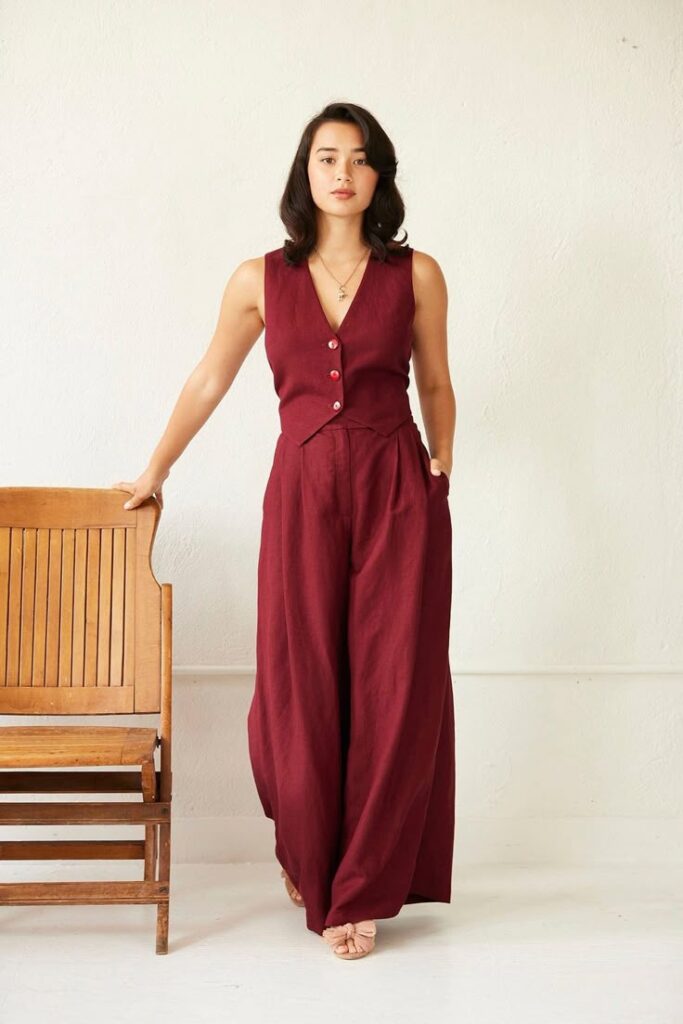 A suit suit with wide-legged maroon pants and a vest. A great wedding officiant outfit option.
