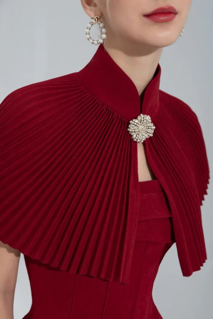 A beautiful red dress with a bolero or shrug like topper. This is an excellent wedding officiant outfit.